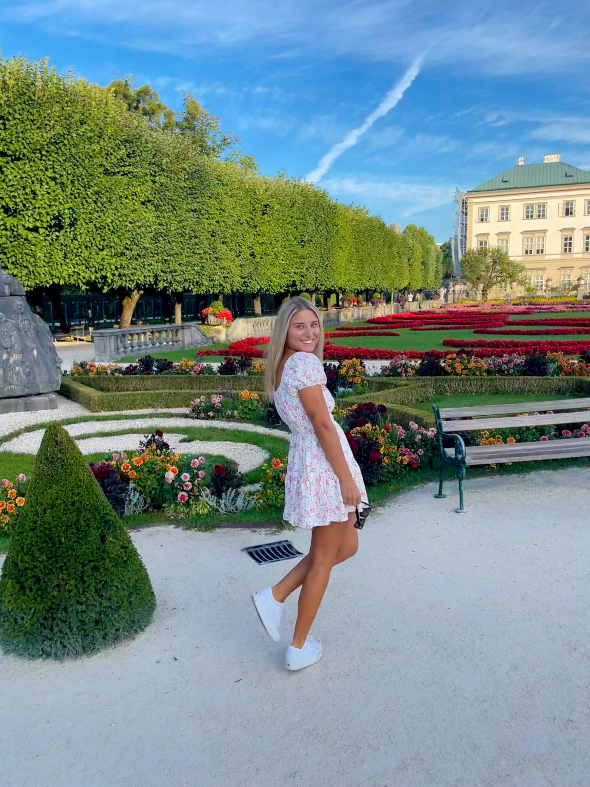 Girl standing in Mirabell Gardens in Salzburg, Austria
