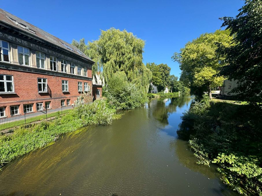 Canal waterway in Odense, Denmark in summer is a good stop on a road trip from Copenhagen to Billund